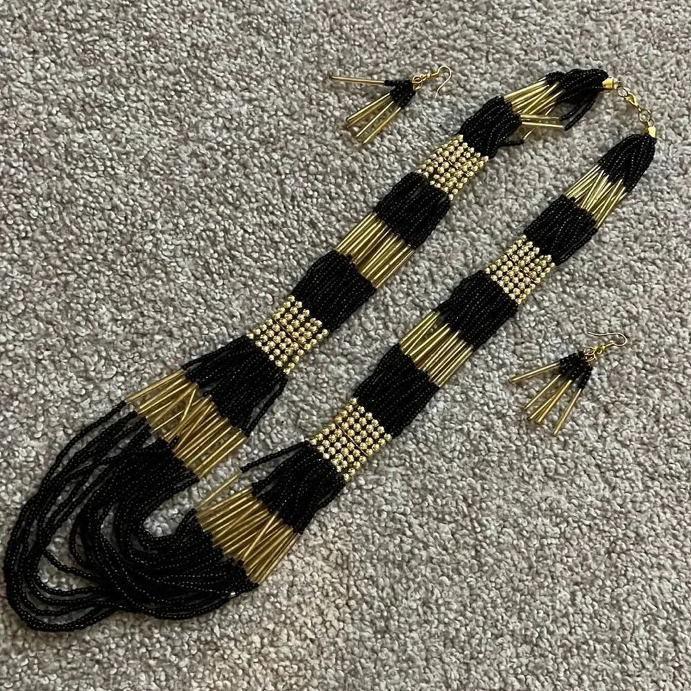 Black and gold multi strand statement necklace with earrings